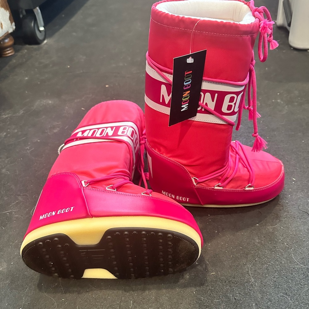 Brand new Moon Boots with tags. Pink.  Tag size 7/8.5.